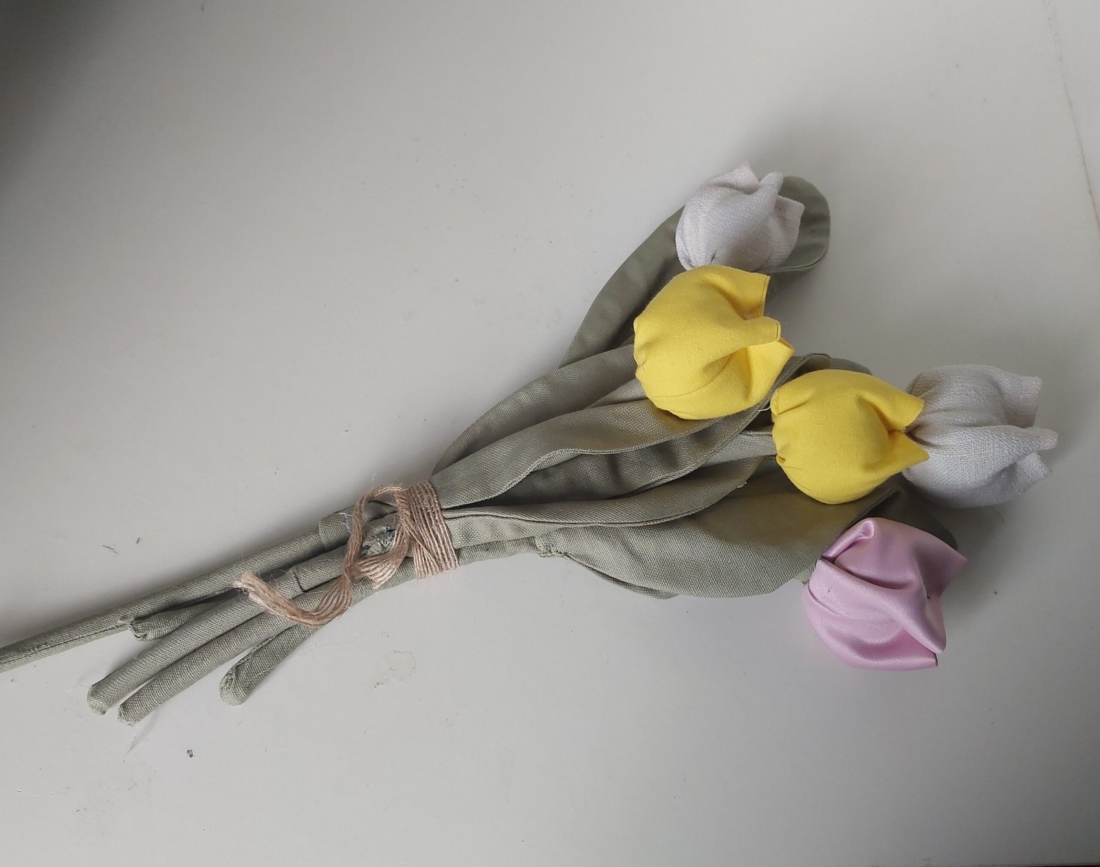 A hand-tied bouquet of linen and cotton tulips